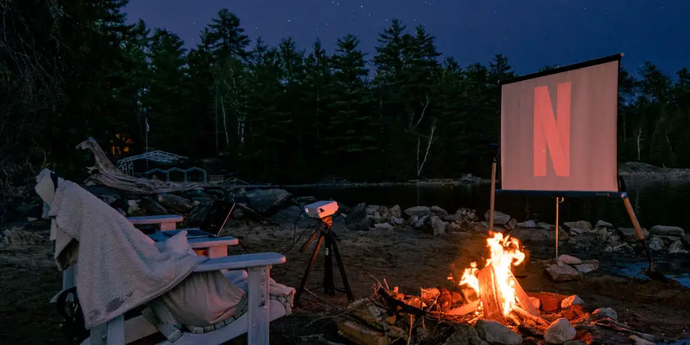 movie watching outdoors projector